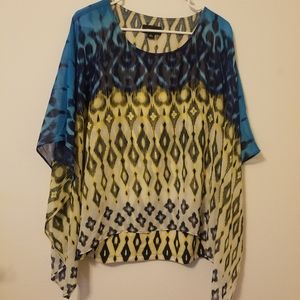 AB Studio poncho draped top over tank.